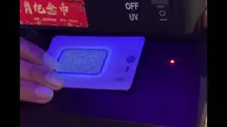Cek keaslian LM emas antam certicard dengan sinar UV