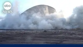 Controlled explosion brings down cooling tower in Germany
