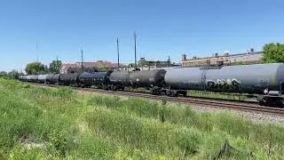 CP 528 with UP 6310 in SP paint trailing