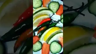 cucumber tomato green chilli yellow  green and lemon .salad healthy
