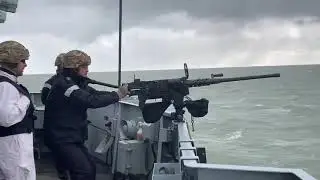 HMS Lancaster fires.50 (12.7mm) calibre heavy machine gun