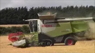 Claas combines cutting through w/barley.2015