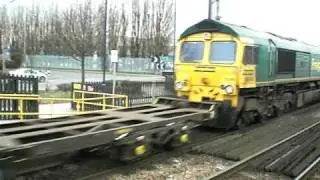 Class 66 hauled Freightliner train passing Bentley Station
