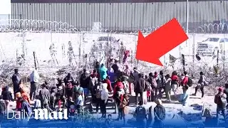 Hundreds of migrants breach southern US border fence in El Paso