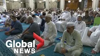 Muslims attend Eid al-Adha prayers in the Middle East