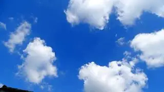 White clouds moving in the blue sky (Time lapse)