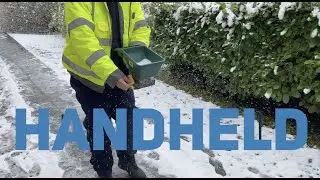 Handheld gritting salt spreader