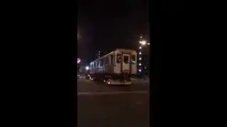 Subway train driving on the streets of Tokyo