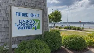 QC's Living Lands and Waters group celebrates site of new headquarters and classroom barge Thursd...