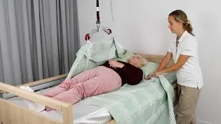 Immedia SatinSheet &ndash; One carer moving user higher up in bed with hoist