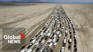 Burning Man exodus: Drone video shows thousands of vehicles trying to leave muddy desert festival