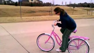 Shana riding her new pink schwinn cruiser bike
