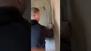 plasterer coating plaster on multiple backgrounds block walls sand ce