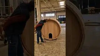 Assembling a huge wine barrel.🤯@italianwinelover #wineinspires #winebarrel #cooper