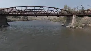 dji fpv flying under a bridge.