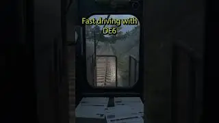 Trying to reach top speed with a DE6 and heavy freight train in Derail Valley