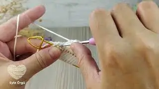 Let's watch what I knitted with colored safety pins.