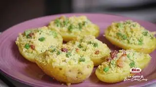 Patate ripiene di cous cous con piselli e bacon