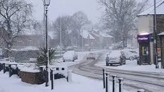 People pictured battling the heavy snow in County Durham this morning