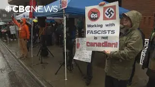 Protesters gather outside Hootsuite headquarters in response to contract with ICE