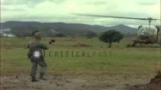 OH-13 helicopter lands at US 1st Air Cavalry Division tent area at Ankhe in South...HD Stock Footage