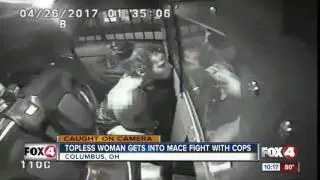 Topless woman tries to mace police officers
