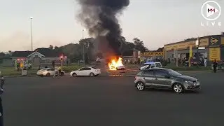 Tow truck bursts into flames after police car crashes into it