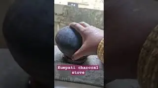 Clay pot cooking on charcoal stove