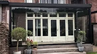 Luxe Flatroof Edition tuinkamer met glas in het dak - glasschuifwanden en een bovendak zonwering