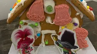 Making a trolls Christmas gingerbread house