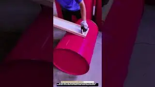 Steel drum printing Worktool applying label designs in factory use
