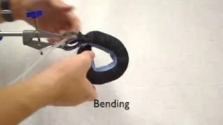 Low-Cost  Bidirectional Fabric-based Soft Actuator using Mechanical Anisotropy of Textile