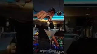 Sexy Bartender pours a dirty martini