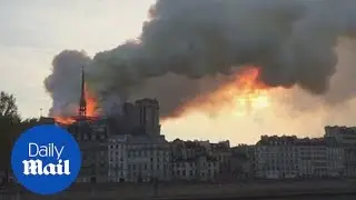 Flames and thick smoke billow from Paris' Notre Dame Cathedral