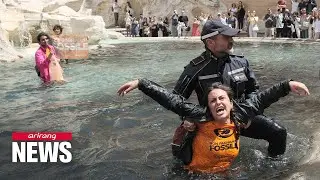 Climate activists turn Italy&rsquo;s iconic Trevi Fountain black