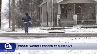 Postal worker robbed at gunpoint