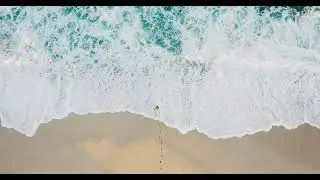 Homepage movie surfer walking out to water