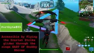 Fortnite Fortbyte#89 Accessible by flying the scarlet strike glider through the rings East of Snobby