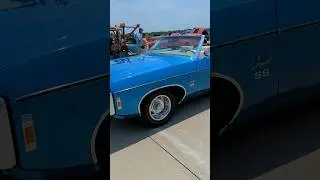 Did you see this? classic car towing speed boat.