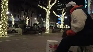 STREET DRUMMER GROOVING MAKING THE PEOPLE MOVE TO THE BEAT .