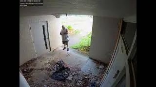 Man enters building through door with faulty latch