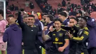 Manchester United players celebrating fulltime with the away fans at the Emirates 