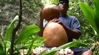 Kalae playing ipu heke and chanting at Halawa Falls