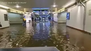 Commuters navigate flooded Los Angeles railway station