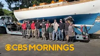 Man building his own boat finally reaches water