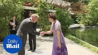 World leaders' wives and Philip May arrive for G20 family photo