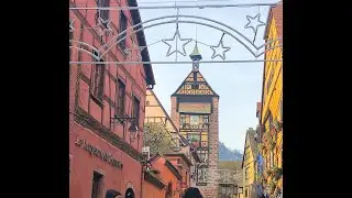 Road Trip Alsace, France to Riquewihr cobbled streets lined with half-timbered buildings