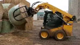 Cat&reg; Bale Grab Attachment at Work