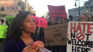 Protesters of President Donald Trump's immigration ban show off their signs along Gervais Street
