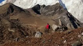 Hiker's Journey Through the Majestic Himalayas of Nepal, Capturing the Beauty of Snow-Capped Peaks